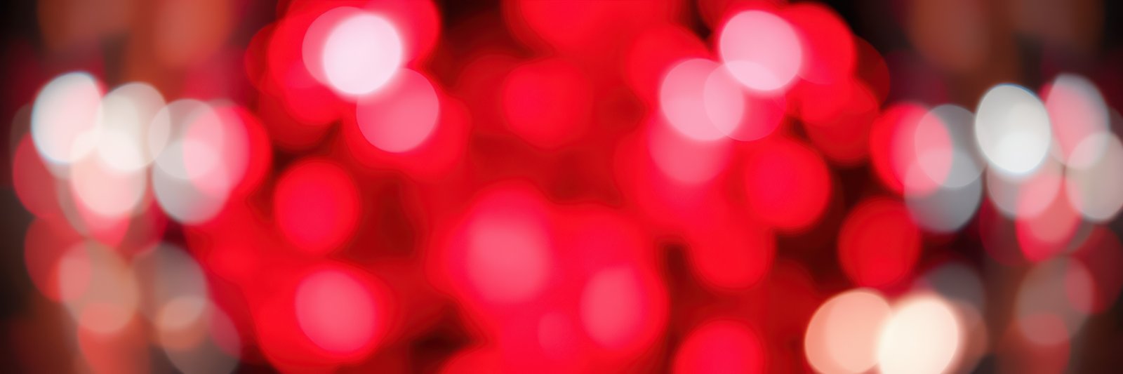 Vibrant red bokeh lights create a festive atmosphere for events and celebrations in urban settings at night